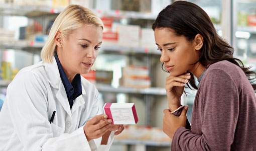 pharmacist consulting with customer